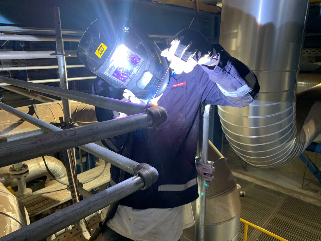 Industrial welding services being carried out on a structural steel component